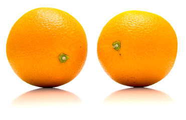 The ripe whole oranges with real reflexion on white. Isolation