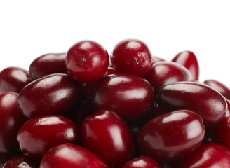 Ripe cornelian berry closeup on white background