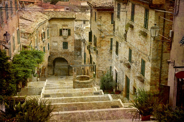 Fototapeta na wymiar Postcard from Italy. - Beautiful staircase Corinaldo, Italy