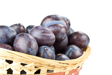 Fresh appetizing plums on a white background