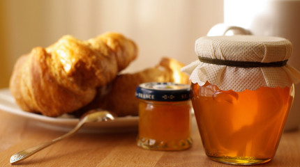 Breakfast with croissant and honey