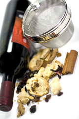 wine, dried fruits, spices and metal strainer