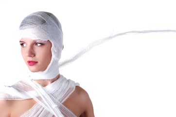 portrait of a young beautiful woman fully in bandage