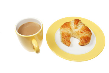 Coffee and croissant on a plate isolated on white