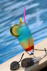 fresh cocktail standing by the swimming pool