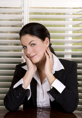 pretty business woman wearing black suit and shirt