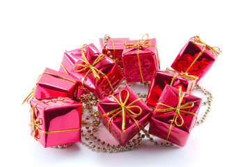 Small gift boxes with a chain on a white background