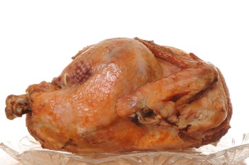 Beautifully browned whole roast turkey isolate on white