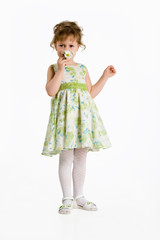 Little girl smelling the flowers