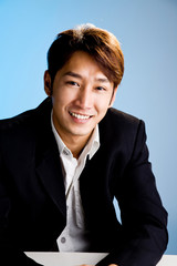 friendly smiles of asian business man in formal attire