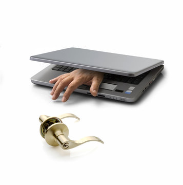 hand emerging from a closed pc laptop trying to open a door lock