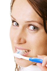 beautiful woman cleaning her teeth