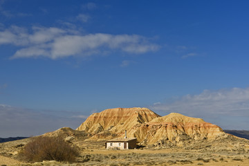 Old shanty under the cloudy sky in spring season