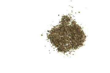 Dried Basil spread out on a white background