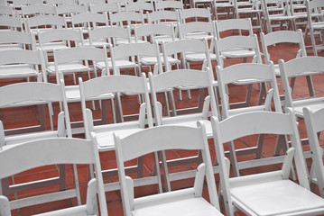Rows of White Catering Event Chairs