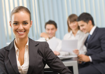 Fototapeta premium Portrait of successful businesswoman and business team