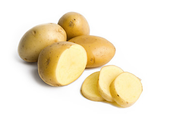 some yellow potatoes isolated on white background