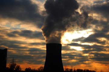 Cooling tower with water stream during sundown