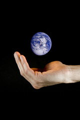 hand holding planet earth