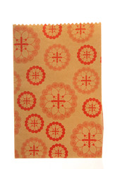 Empty red and brown paper bag isolated on white,