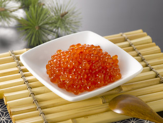 The fresh salmon roe on white plate © Norwalk