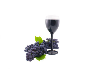 Glass of red wine and grapes isolated on a white background