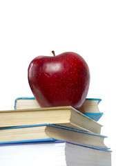 apple and stack of books