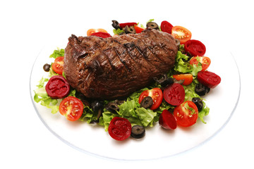 meat and vegetables on transparent dish