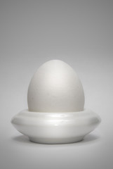 Fototapeta na wymiar egg in the eggcup vertical