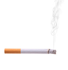 Smoking cigarette isolated against white background