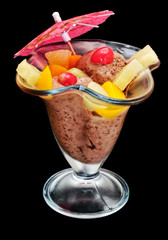Ice cream with fruits on black background.