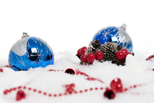 Horizontal image of blue christmas balls on snow