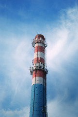 urban chimney-stalk on a background cloudy sky