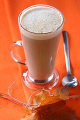 coffee latte in orange fall autumn style, shallow DOF