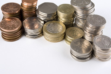 Random piles of used UK coins with copy space