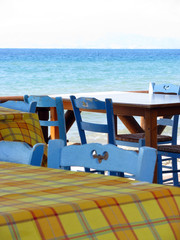 Blue chairs by the sea