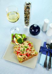 Open chicken sandwich with avocado, peppers and cheese