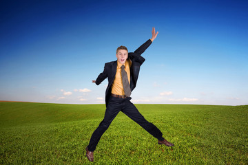 Fototapeta na wymiar An image of jumping man on a field