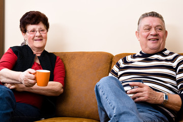 Cousy scene of a elderly couple sitting and relaxing