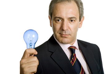 mature business man with a lamp isolated on white