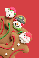 Gingerbread men cookies on red.