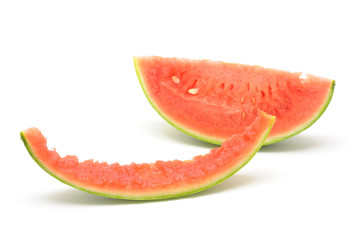 Slice of watermelon and skin in isolated white background