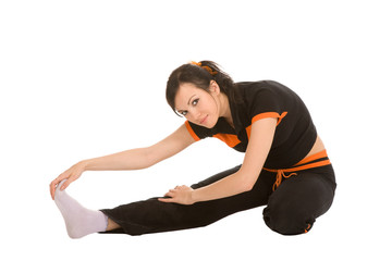 Fototapeta premium young woman makes exercises on a white background
