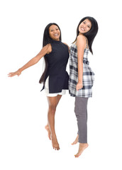 Young asians jumping for joy