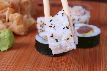 Appetizer sushi with chopsticks