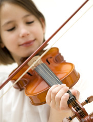 young girl with violin focused on hand isolated on white