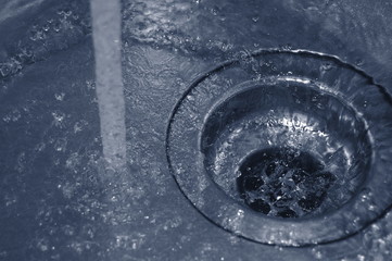 water flow into the drain in the kitchen