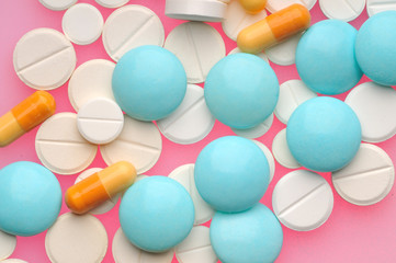 Some pills over color background