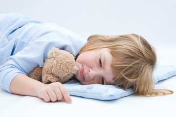 child with teddy bear, sleeping and crying