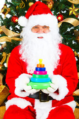 Smiling Santa and Christmas Tree. Over white background.
